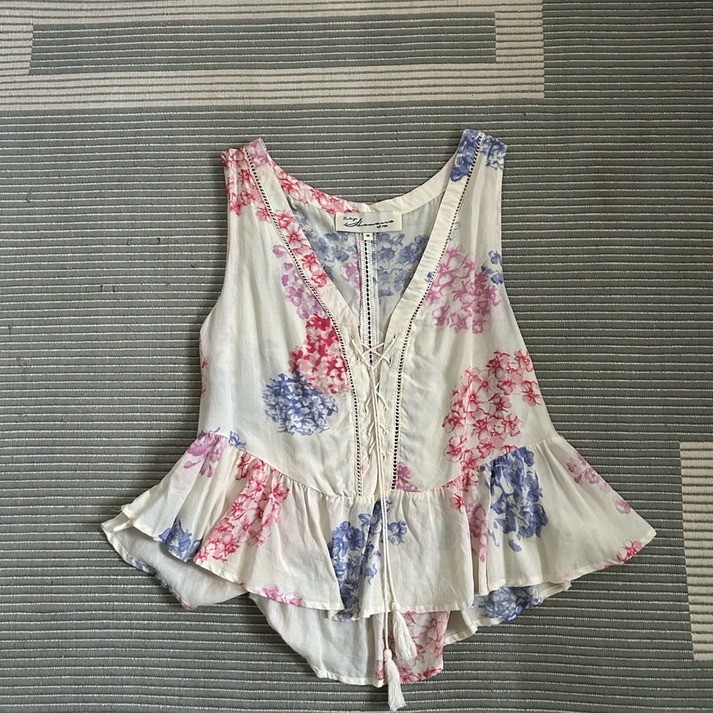 Vintage Havana top. Cream colored w/ floral print. Lace up/tie in the front.